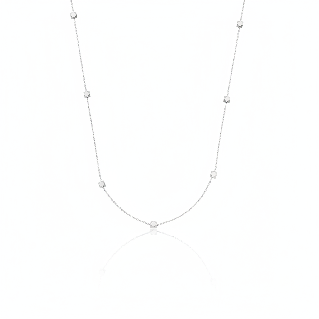 white gold faceted nugget station necklace on a white background