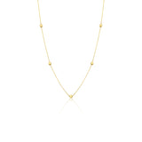 yellow gold faceted nugget station necklace on a white background
