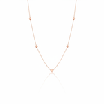 rose gold faceted nugget station necklace on a white background