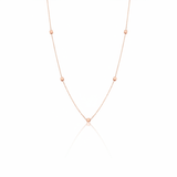 rose gold faceted nugget station necklace on a white background