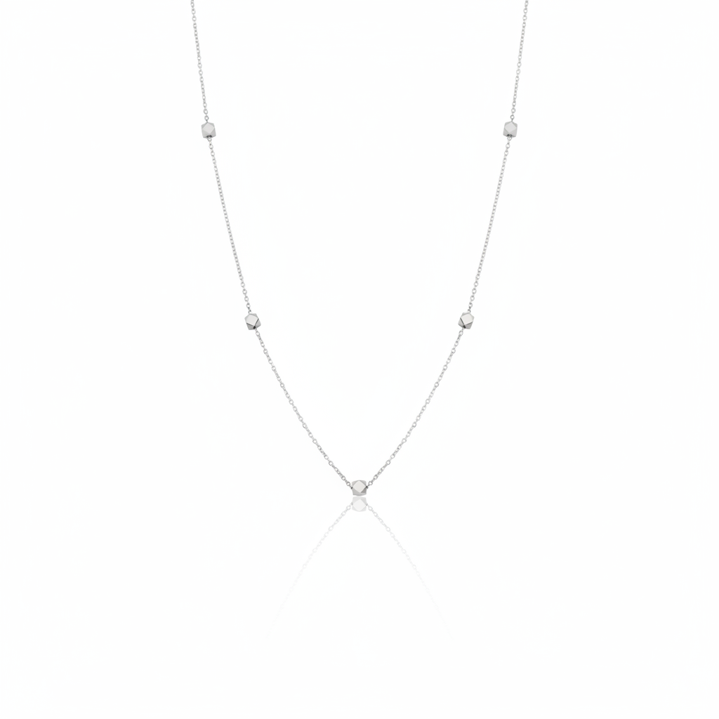 white gold faceted nugget station necklace on a white background