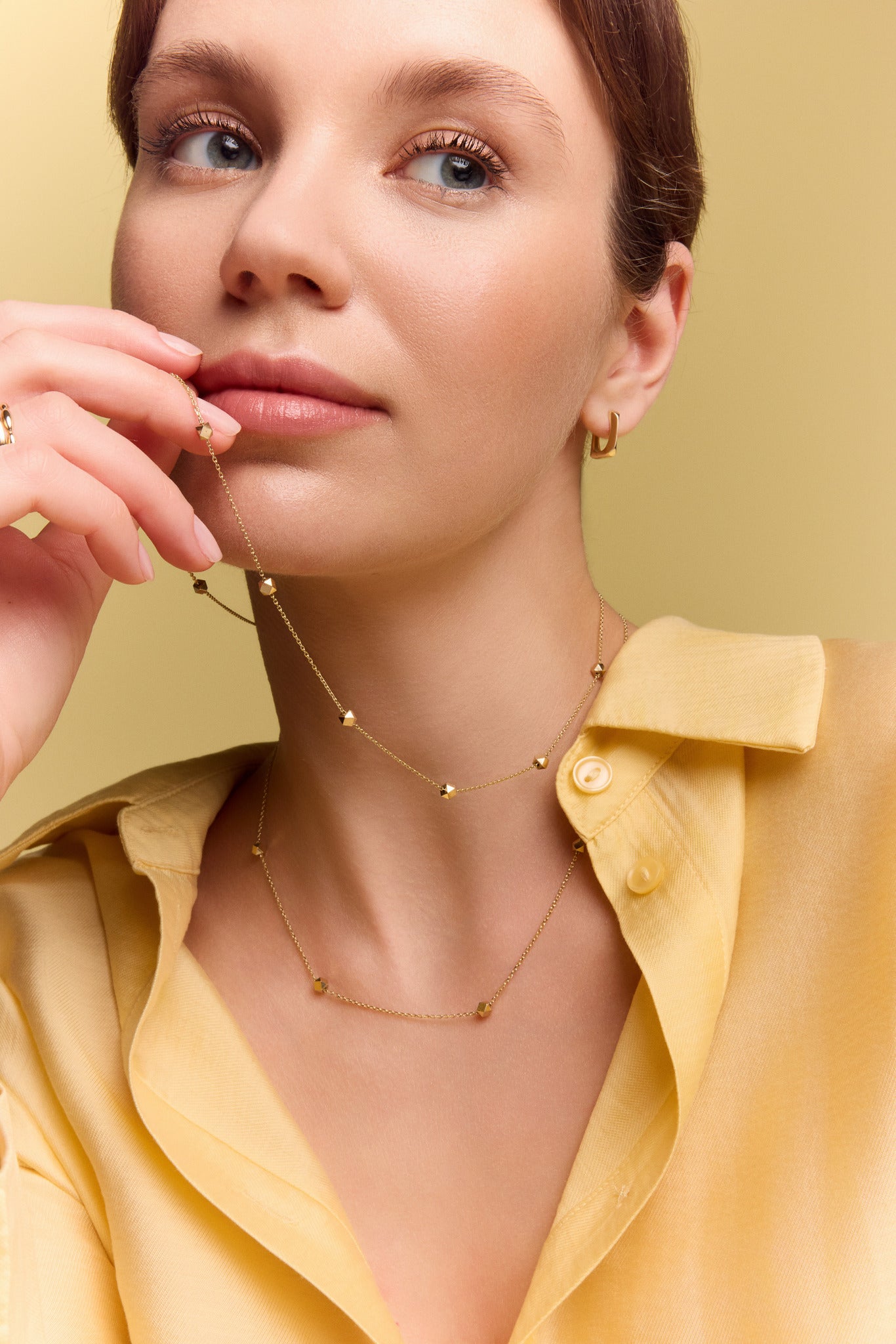 model wearing the gold collarbone station necklace