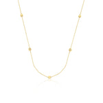 yellow gold faceted nugget station necklace with small stone accents on a white background