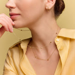 model wearing the gold stone accent necklace