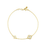 yellow gold clover charm bracelet with White CZ stones on white background