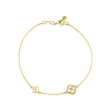 yellow gold clover charm bracelet with White CZ stones on white background