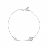 white gold clover charm bracelet with White CZ stones on white background