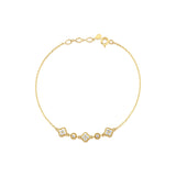 yellow gold clover and round link station bracelet with White CZ stones on white background