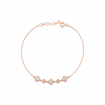 rose gold clover and round link station bracelet with White CZ stones on white background
