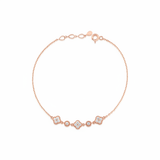 rose gold clover and round link station bracelet with White CZ stones on white background