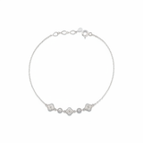 white gold clover and round link station bracelet with White CZ stones on white background