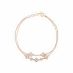 rose gold double-strand clover bracelet with White CZ stones on white background