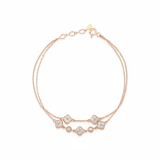 rose gold double-strand clover bracelet with White CZ stones on white background