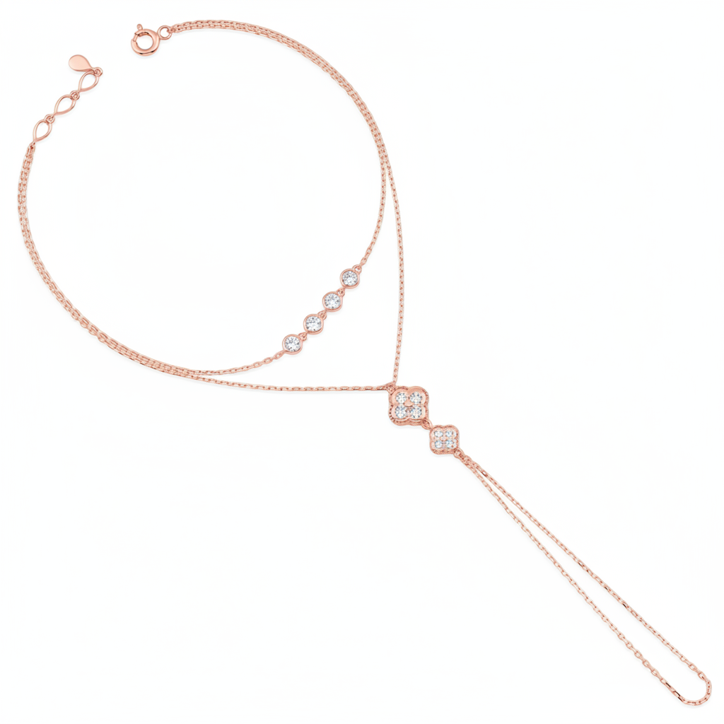 rose gold hand chain bracelet with bezel-set stones and a floral motif drop on white background
