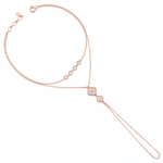 rose gold hand chain bracelet with bezel-set stones and a floral motif drop on white background