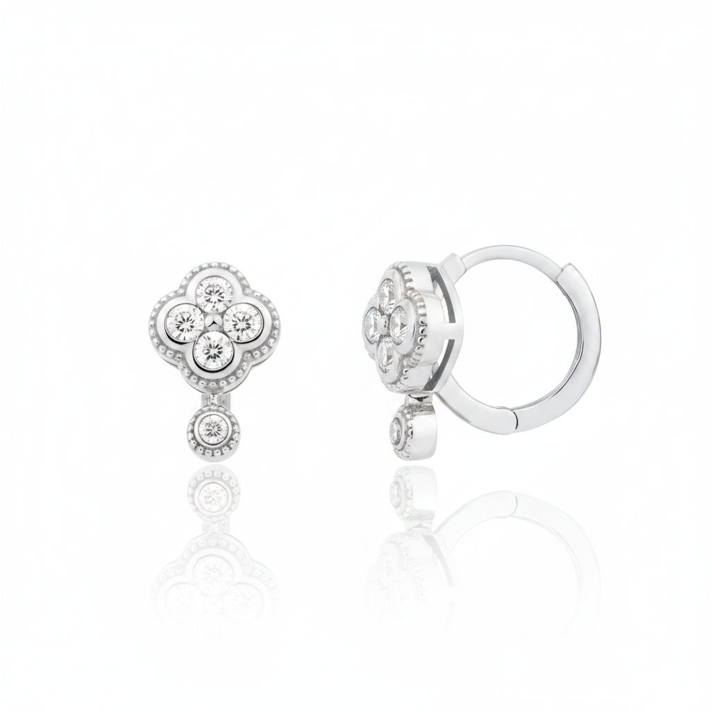white gold clover huggie hoop earrings with White CZ stones on white background