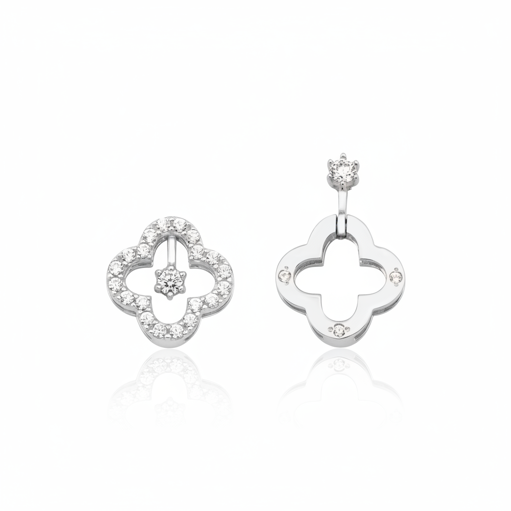 white gold asymmetric clover earrings on white background
