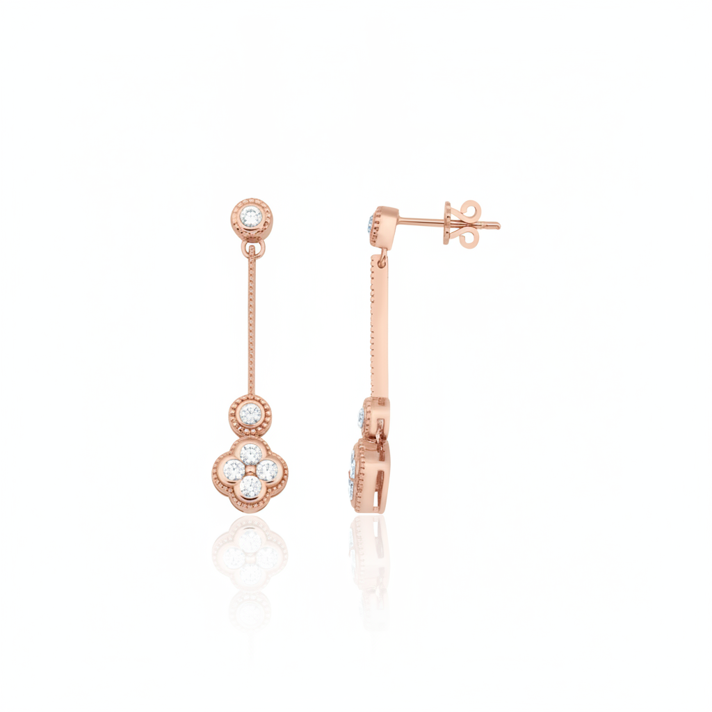 Rose gold quatrefoil drop earrings with White CZ stones on white background