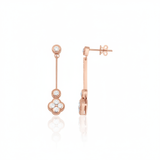 Rose gold quatrefoil drop earrings with White CZ stones on white background