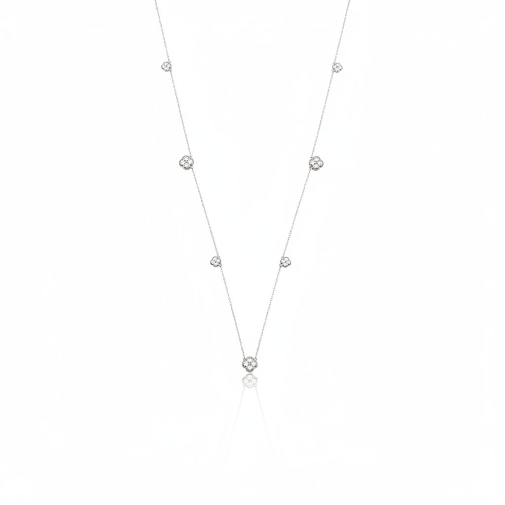 White gold clover station necklace with White CZ stones on white background