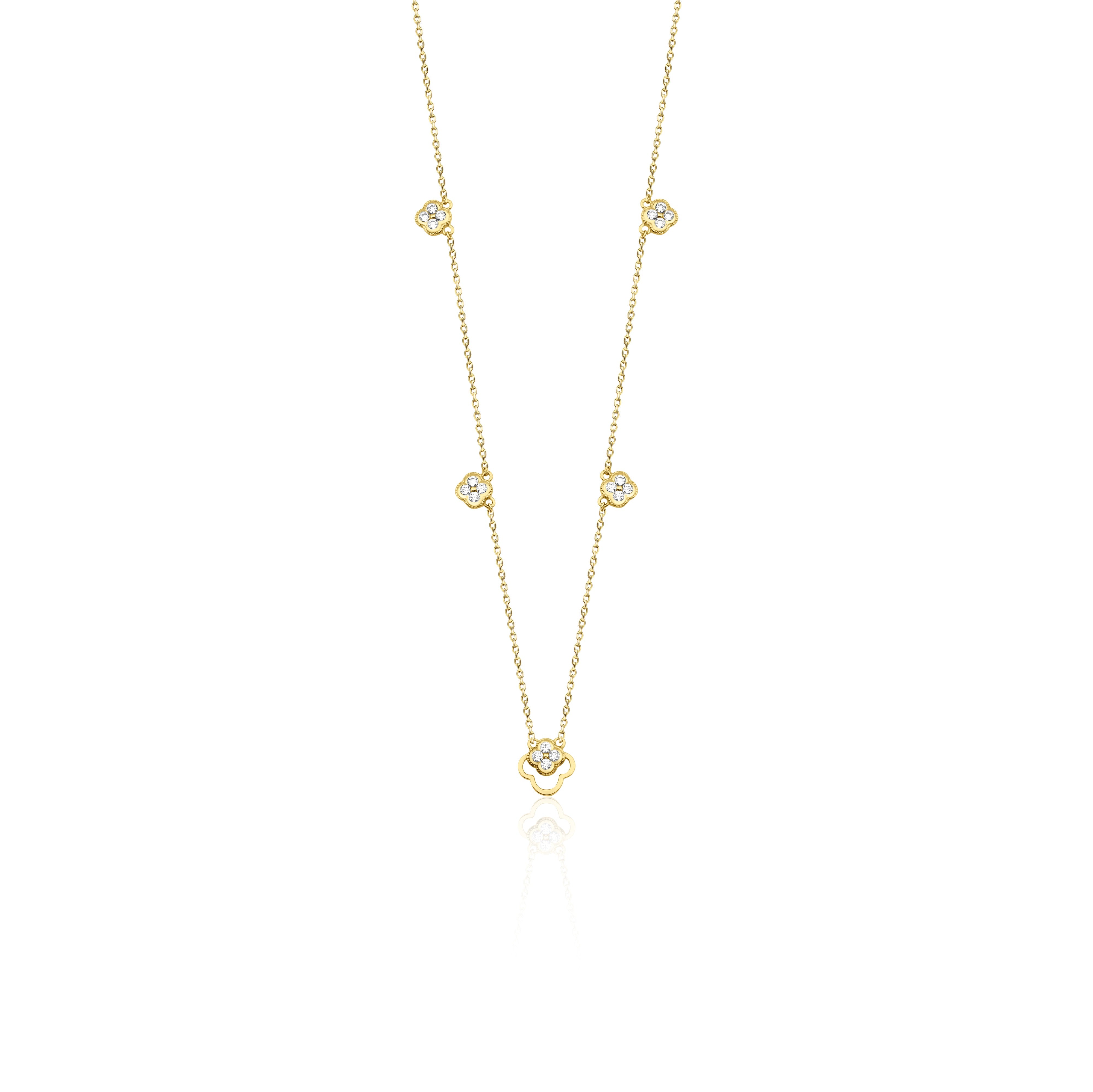 Yellow gold clover outline necklace with White CZ stones on white background
