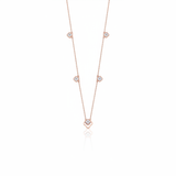 Rose gold clover outline necklace with White CZ stones on white background