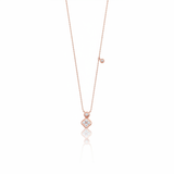 Rose gold clover charm necklace with a bezel-set accent stone on white background