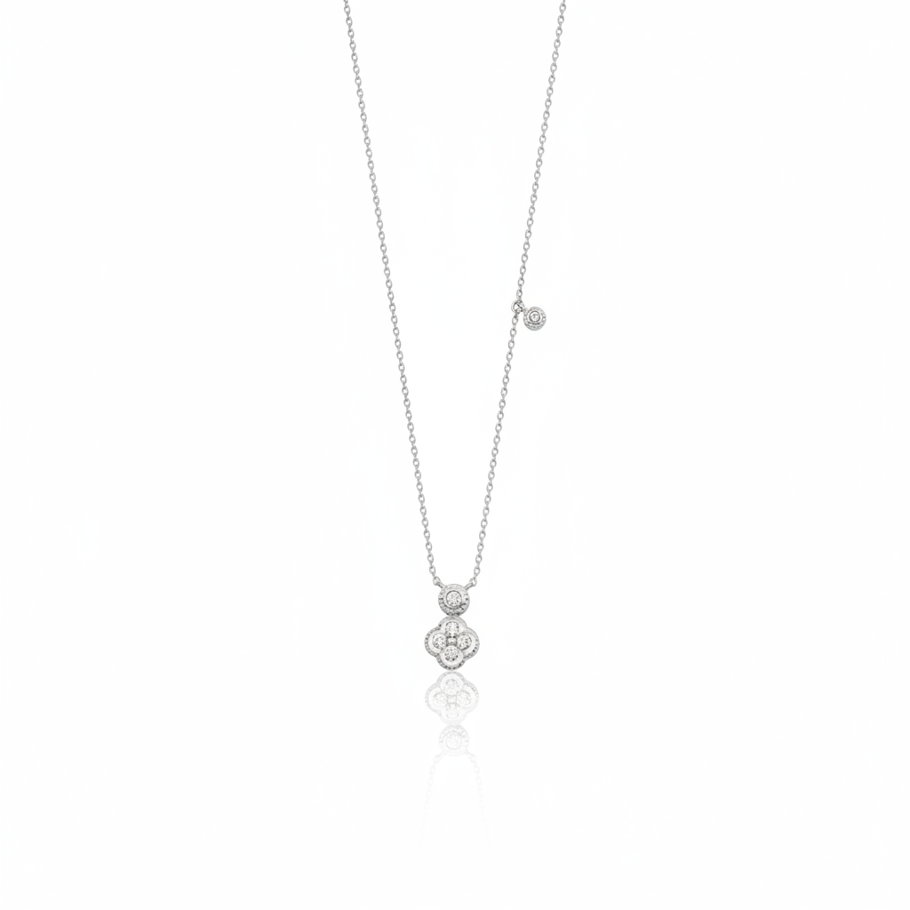 White gold clover charm necklace with a bezel-set accent stone on white background