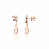 rose gold petal drop earrings with a pear-cut stone on white background