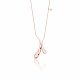 rose gold crossed teardrop pendant necklace on white background