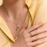 model wearing the gold crossed drops pendant necklace