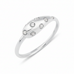 white gold star-set dome ring with flush-set stones on white background