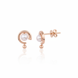rose gold arc stud earrings with a pearl on white background