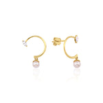 yellow gold marquise hoop earrings with a dangling pearl on white background