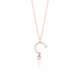 rose gold open arc pendant necklace with a dangling pearl on white background