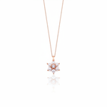 rose gold floral cluster pendant necklace with pearls on white background