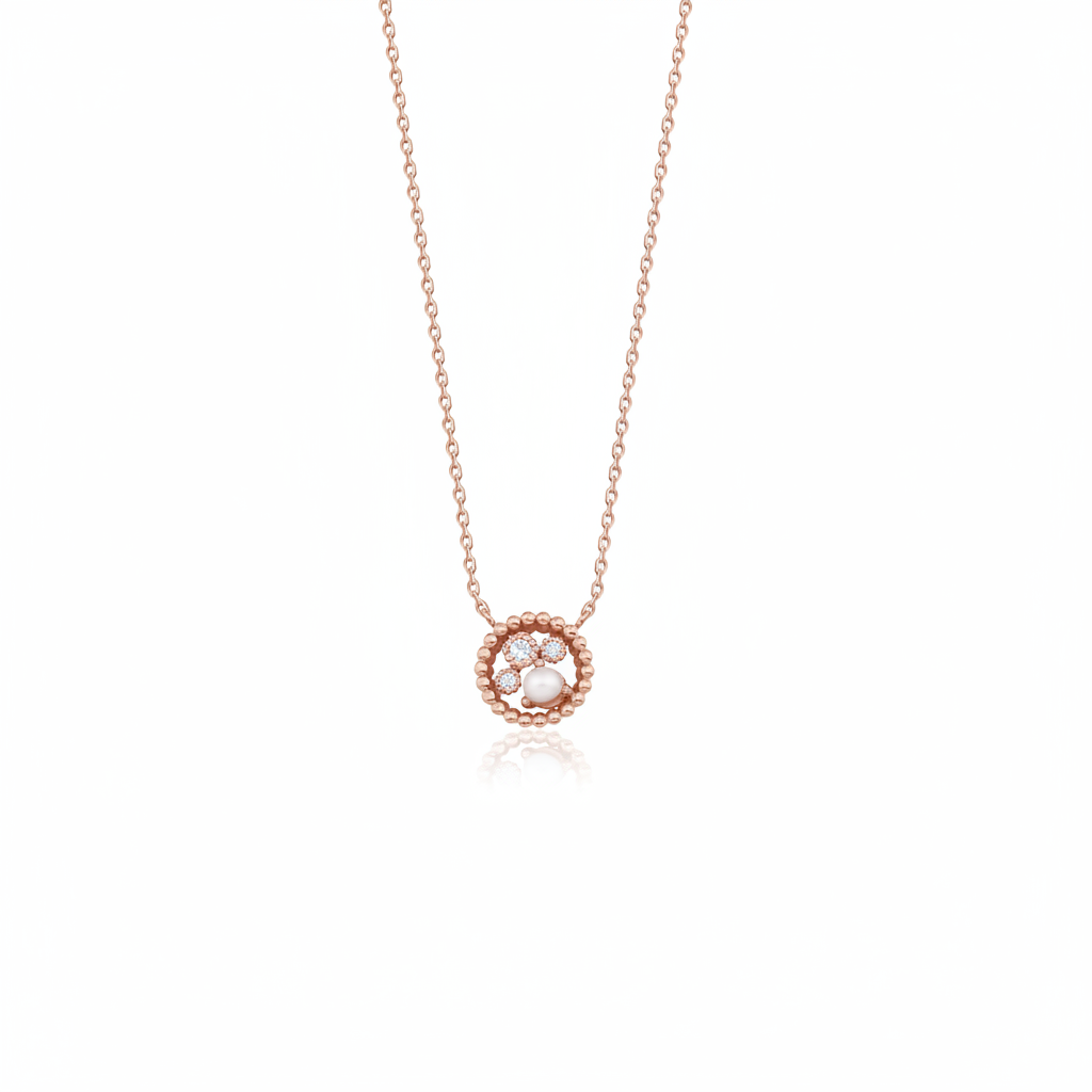 rose gold beaded orbit pendant necklace with a pearl on white background