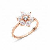 rose gold floral band ring with pearls on white background
