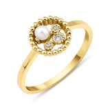 yellow gold asymmetrical halo ring with a pearl on white background