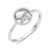 white gold asymmetrical halo ring with a pearl on white background