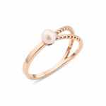 rose gold twisted rope ring with a pearl on white background