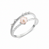 white gold solitaire pearl ring on white background