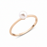 rose gold criss-cross ring with a pearl and a marquise stone on white background