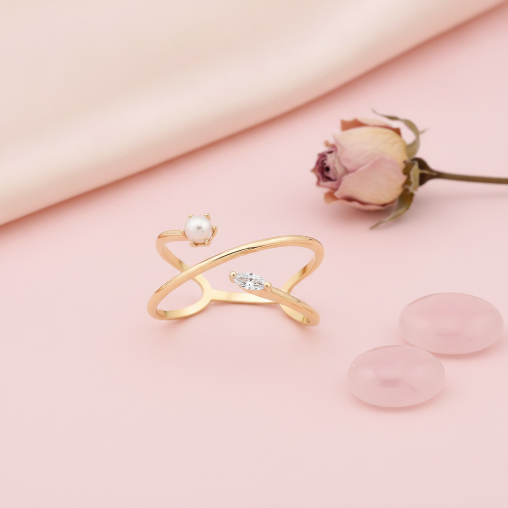 yellow gold split band ring with White CZ stones and a pearl, styled on cream silk with dried baby's breath