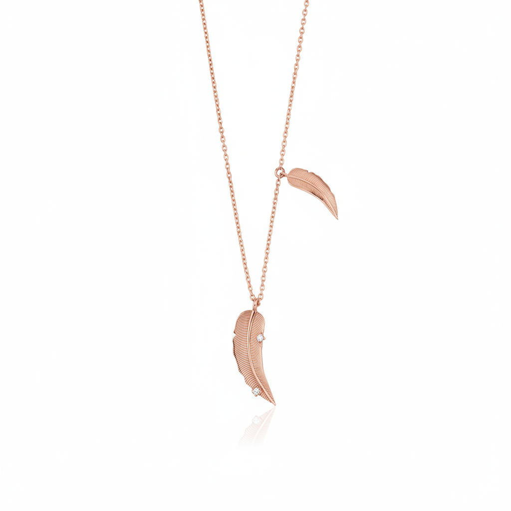 rose gold double feather pendant necklace on white background