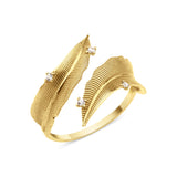yellow gold open feather wrap ring on white background