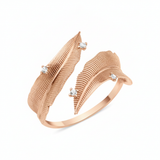 rose gold open feather wrap ring on white background