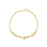 yellow gold double strand bracelet with White CZ stones on white background