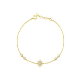 yellow gold astra star bracelet with White CZ stones on white background