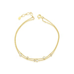 double strand bracelet in yellow gold on white background